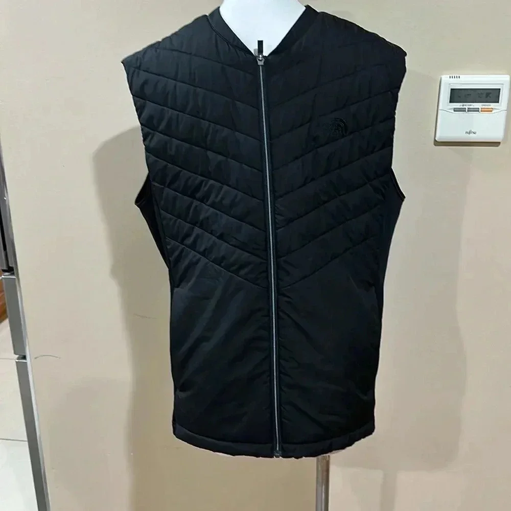 The North Face black puffer vest full front zip, pockets, front and back logo
